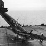 A Supermarine Seafire fighter sits on the flight deck of HMS Smiter after a nose over landing accident in 1944. (Imperial War Museums Photograph.)
