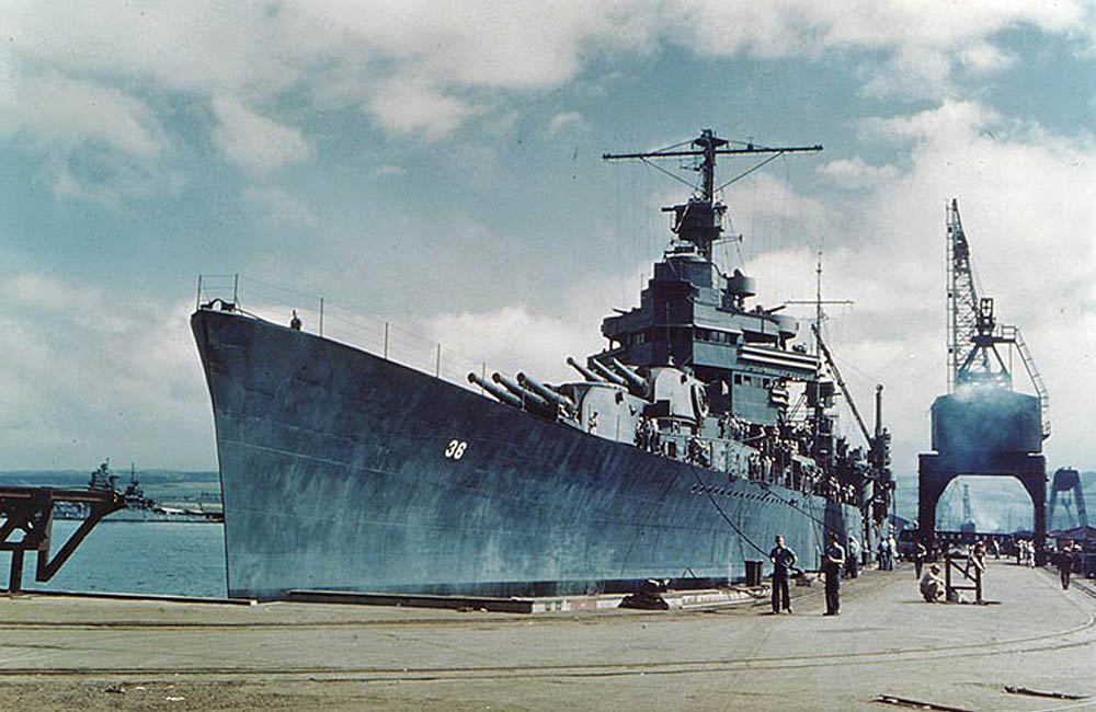 USS Minneapolis (CA-36), a U.S. Navy New Orleans-class heavy cruiser, is docked at Pearl Harbor Navy Yard, Hawaii in April 1943 after repairs. (U.S. Navy Photograph.)