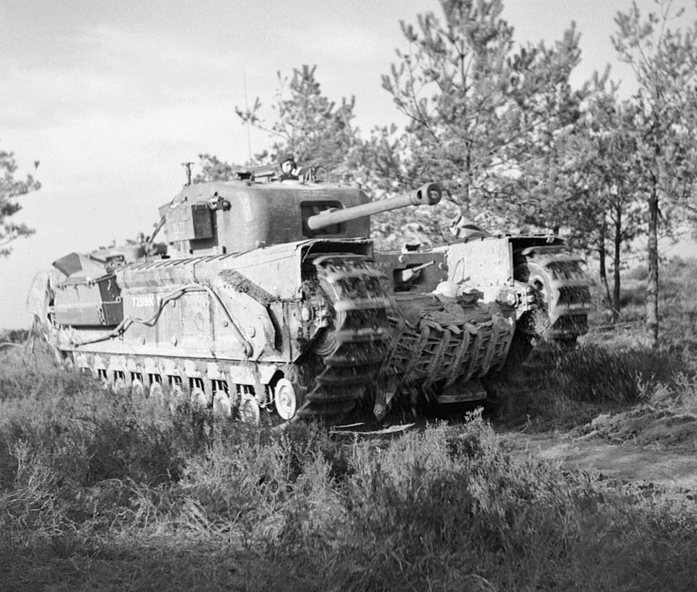A Churchill tank from the 9th Royal Tank Regiment, 31st Tank Brigade advances toward Goch, Germany in February 1945. (Imperial War Museums Photograph.)