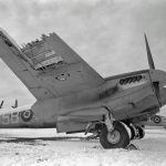 Damaged de Havilland Mosquito FB Mark VI of RAAF No. 464 Squadron based at Hunsdon, Hertfordshire, parked at Friston Emergency Landing Ground, Sussex in February 1944. (Imperial War Museum Photograph.)