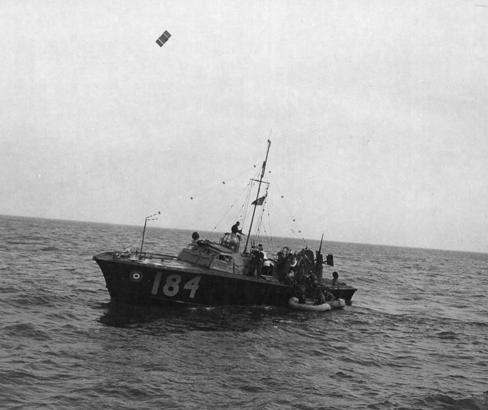 A rescue vessel from the Air Sea Rescue Service pulls alongside two rubber dinghies with crew members of a B-17 Flying Fortress forced down in the North Sea in August 1943. (U.S. Air Force Photograph.)