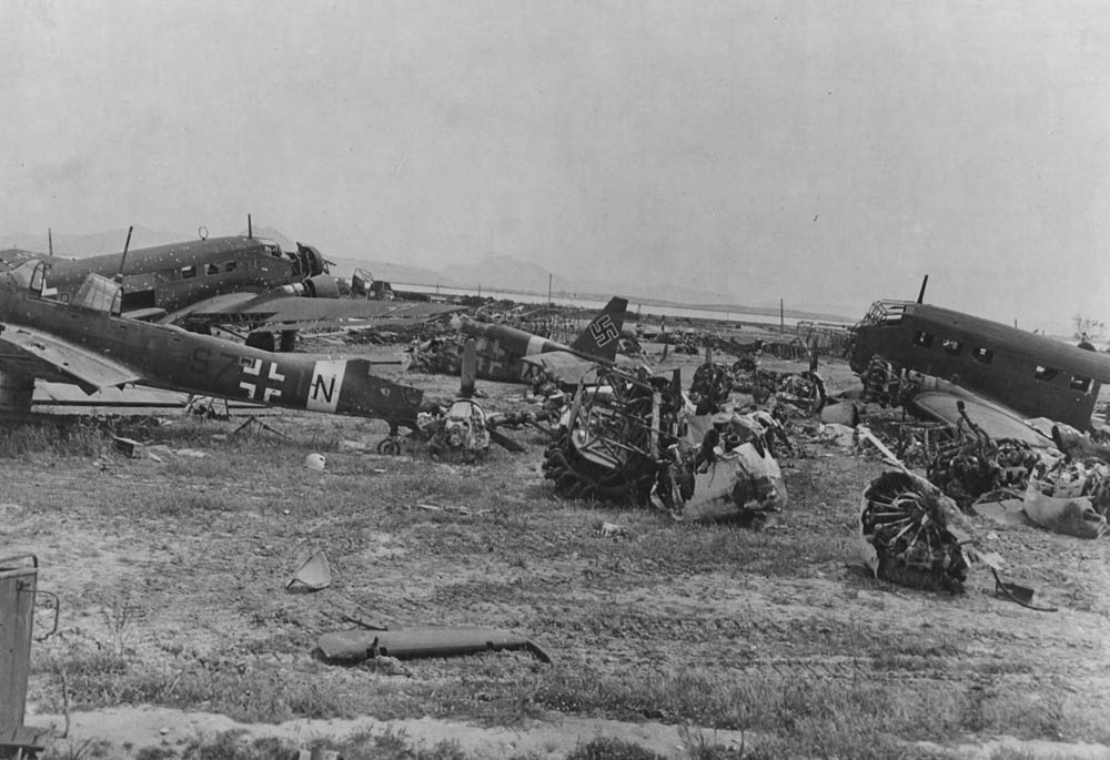 German and Italian aircraft wreckage photographed on the El Aouina airfield neaar Tunis in Tunisia. Visible are wrecks of a Junkers Ju 87 Stuka and several Junkers Ju 52s. (U.S. Air Force Photograph.)
