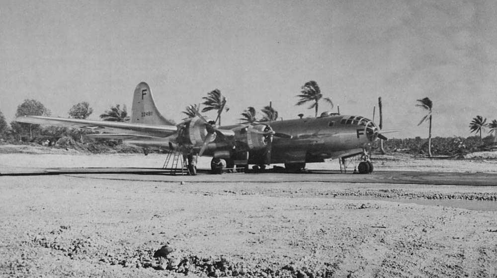 Mechanics perform maintenance work on a Boeing B-29 Superfortress, converted to an F-13 photographic reconnaissance variant, on Guam in the Mariana Islands. (U.S. Air Force Photograph.)