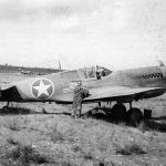 A Curtiss P-40 Warhawk fighter shows the American flag markings used for Operation Torch at airfield in North Africa. (U.S. Air Force Photograph.)
