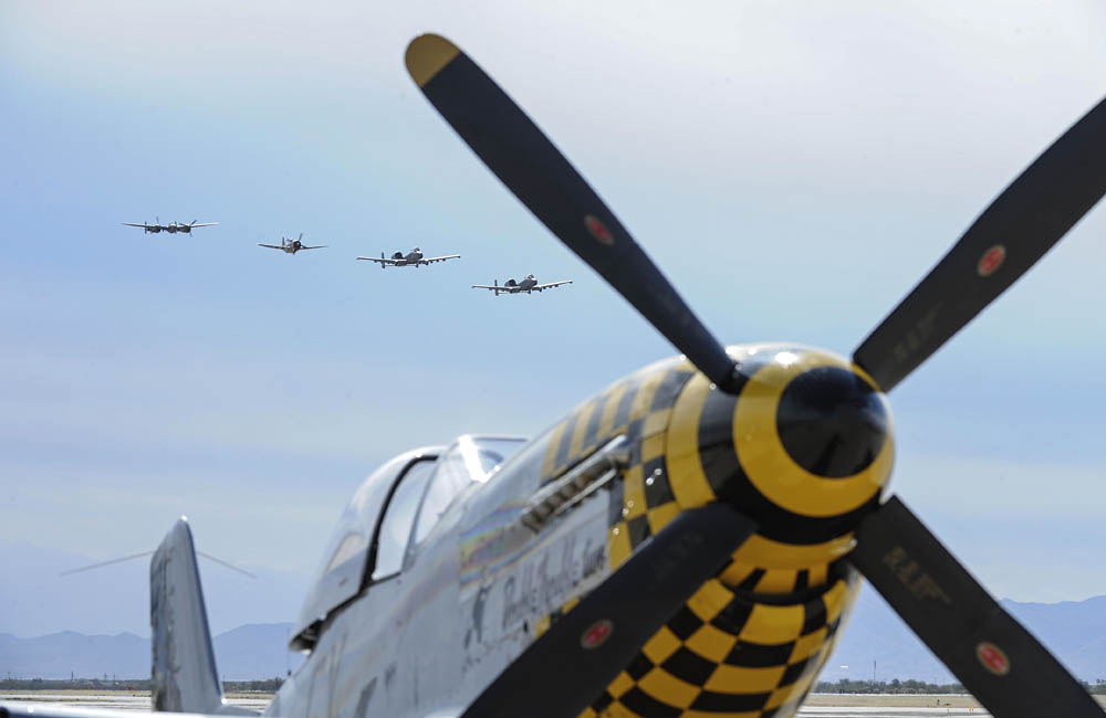 A Heritage Flight formation of A-10 Thunderbolt IIs, a P-38 Lightning and a P-47 Thunderbolt flies over a P-51 Mustang at Davis-Monthan Air Force Base, Arizona. (U.S. Air Force Photograph by Airman 1st Class Mya M. Crosby.)