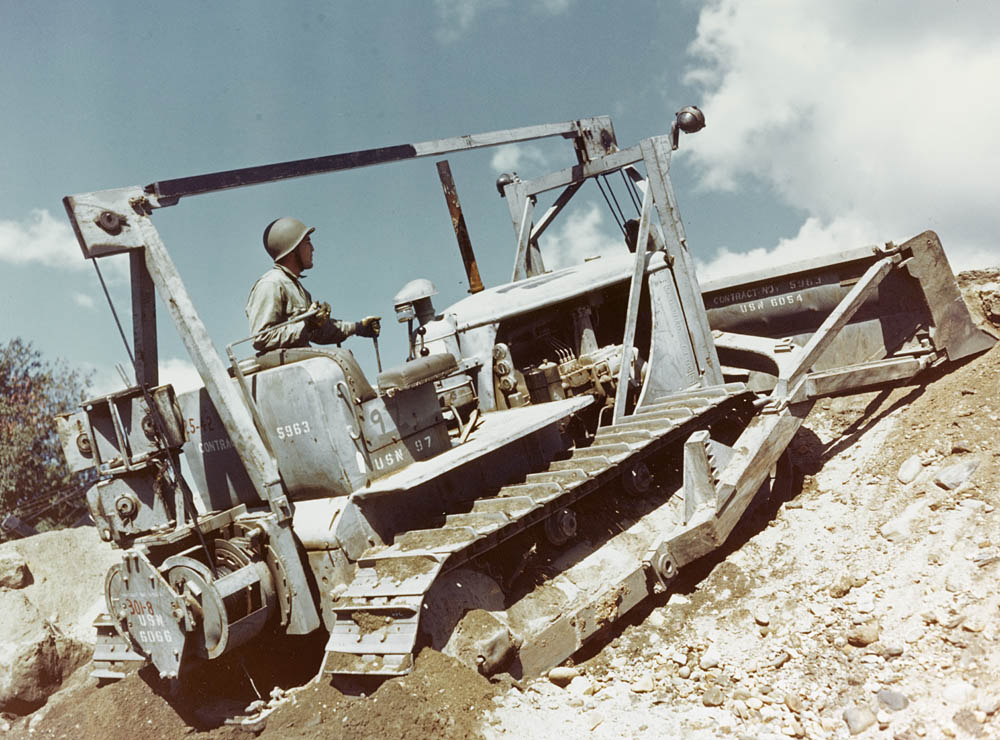 A Seabee Caterpillar D7 medium bulldozer goes to work at the Construction Battalion Training Center, Camp Endicott, Davisville, Rhode Island, in the fall of 1943. (U.S. Navy Photograph.)