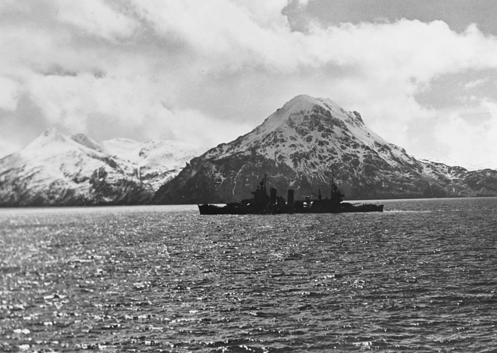 The New Orleans-class cruiser USS San Francisco (CA-38) passes in front of mountains in Kulak Bay, Adak, Aleutian Islands in April 1943. (Official U.S. Navy Photograph, National Archives.)