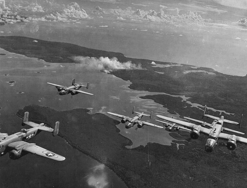 North American B-25 Mitchells from the 42nd Bombardment Group fly in formation over Bougainville from their base at Stirling Airfield, Solomon Islands in 1944. (U.S. Air Force Photograph.)