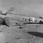 The wreck of a German Junkers Ju 88 lies abandoned in North Africa, typically identified as a reconnaissance variant belonging to Aufklärungsgruppe 121. (U.S. Air Force Photograph.)