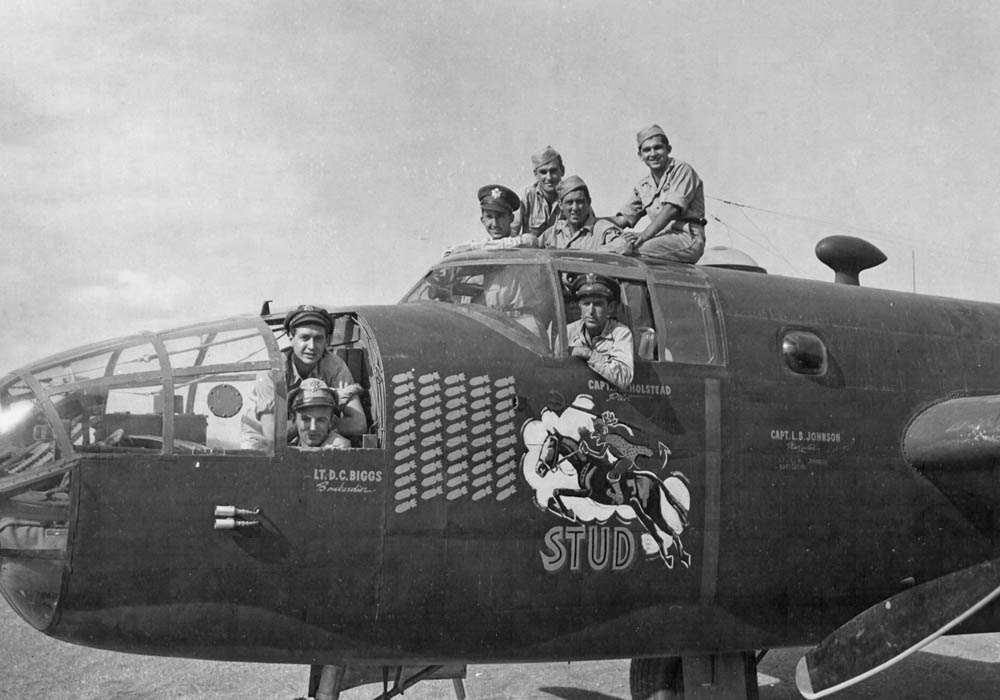 The crew of a North American B-25 Mitchell, nicknamed STUD, poses with their aircraft, a veteran of over fifty missions, before flying back to the United States to tour the country promoting War Bonds. (U.S. Air Force Photograph.)