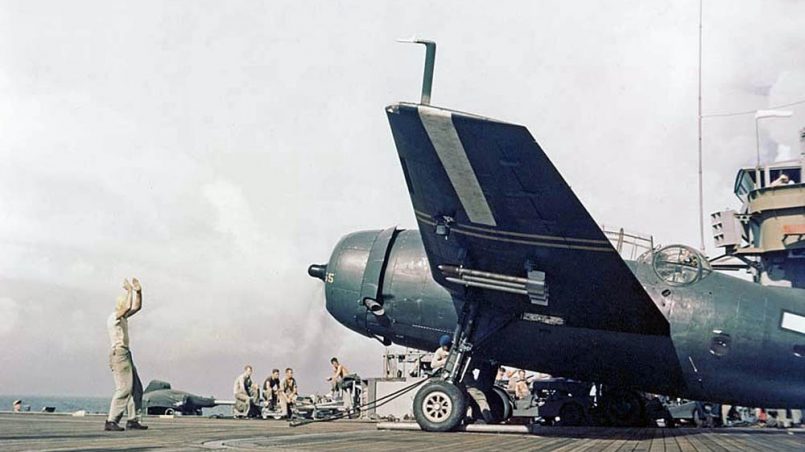 Sailors direct a rocket-armed TBM Avenger on the flight deck of USS Cape Gloucester (CVE-109) during operations off Kyushu, Japan in September 1945. (U.S. Marine Corps Photograph.)