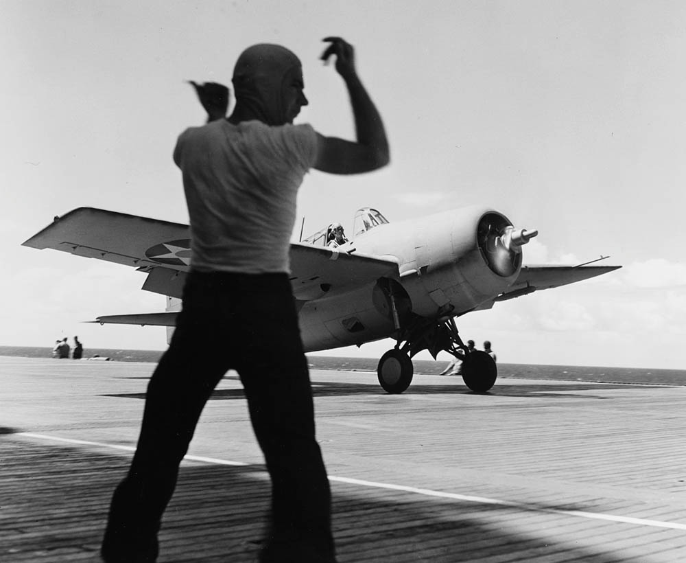 A Grumman F4F-3 Wildcat fighter from Fighting Squadron Three (VF-3) prepares for takeoff on the deck of the aircraft carrier USS Saratoga (CV-3), circa 1941. (U.S. Navy Photograph, U.S. National Archives.)