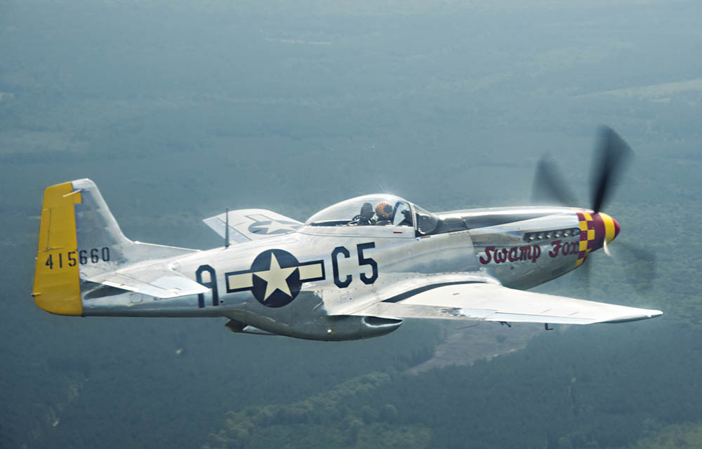 The P-51D Mustang "Swamp Fox" flies over South Carolina for a photo event.  The P-51D is painted in the markings of the WWII aircraft of Lt. Will Foard with the 364th Fighter Squadron, 357th Fighter Group, 8th Air Force based in Leiston, England. (U.S. Air National Guard photograph by Master Sgt. Carl Clegg.)