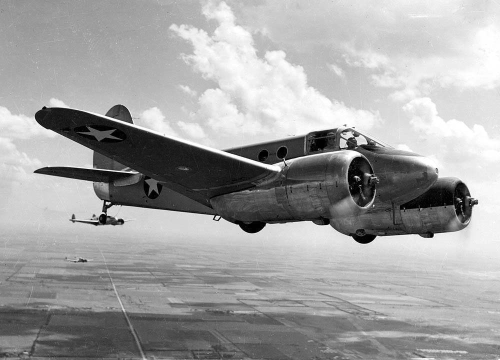 A Beechcraft AT-10 Wichita light, twin-engine trainer leads a formation flight with Beechcraft AT-11 Kansans in the background.  (U.S. Air Force Photograph.)