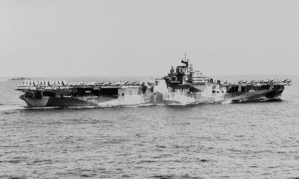A starboard view of the U.S. Navy aircraft carrier USS Hornet (CV-12) underway in September 1944 displaying the dazzle camouflage pattern Camouflage Measure 33.  (U.S. Library of Congress Photograph.)
