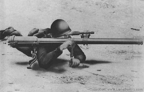 [57-mm Recoilless Rifle: Firing from Prone Position]
