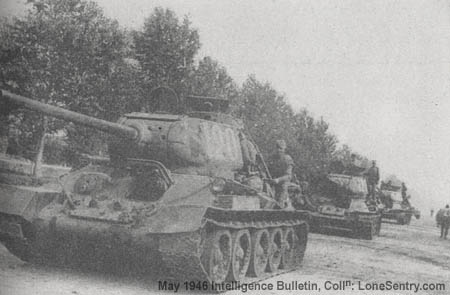 [T34 medium tanks on the road in Manchuria. Like the tank destroyers, they are the organic armored strength within the two tank regiments of the cavalry corps.]