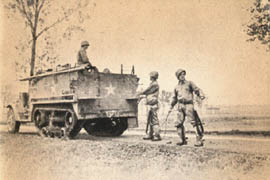 [6th Armored: Halftrack Lays Signal Cable]