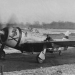 Ground Crewman Rides the Wing of a P-47 Thunderbolt