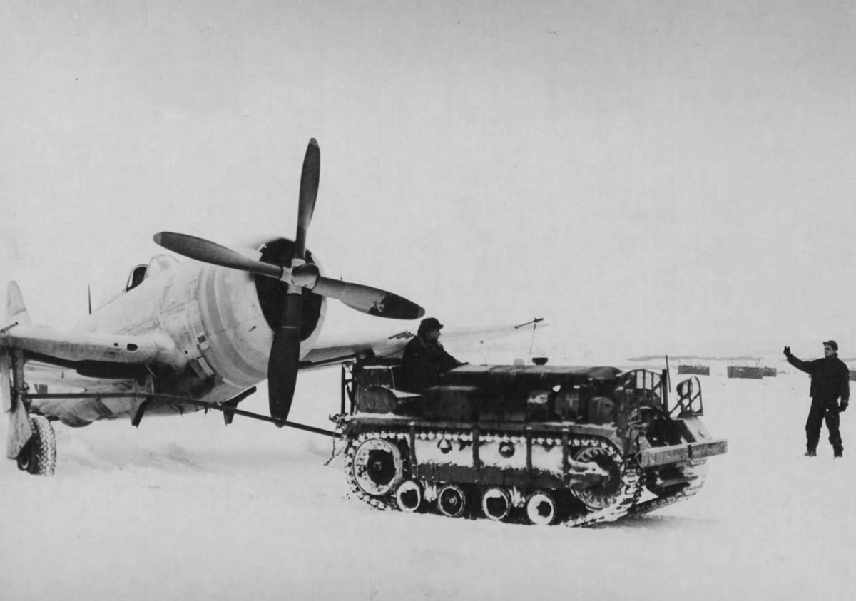 tractor tows a p-47 thunderbolt