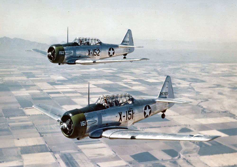 U.S. Army Air Forces North American AT-6C-NT Texan trainers (X-151 s/n 42-43925 and X-152 s/n 42-43929) in flight after taking off from Luke Field, Arizona, in 1943. (U.S. Air Force Photo from the National Museum of the USAF.)