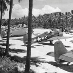 Grumman F6F-3 Hellcat fighters of the U.S. Navy Fighting Squadron 40 (VF-40) on the runway at Espiritu Santo. (U.S. Navy Photograph.)