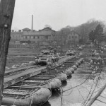 The U.S. Army 607th Tank Destroyer Battalion crosses the Saale River on a pontoon bridge near Saalfeld, Germany in April 1945. (U.S. Army Photograph.)