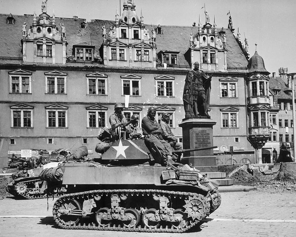 U.S. light tanks and crewmen wait for orders in Coburg, Germany. (U.S. National Archives.)