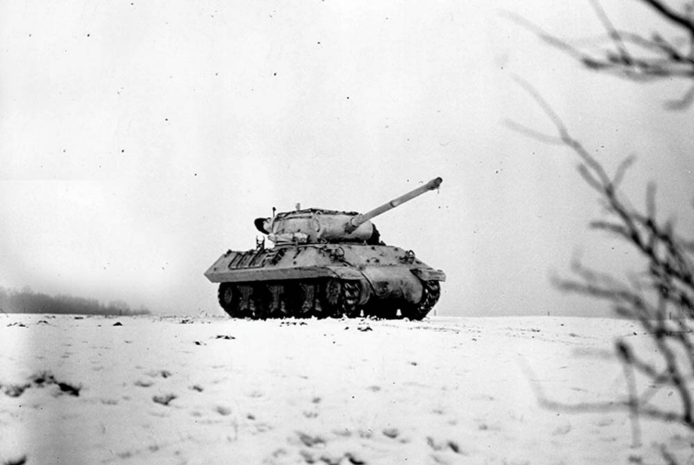 A snow-camouflaged M36 tank destroyer crosses a field near Dudelange, Luxembourg in January 1945. (U.S. Army Photograph.)