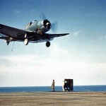 The Landing Signal Officer (LSO) on the aircraft carrier USS Ranger (CV-4) waves off a Douglas SBD Dauntless aircraft, June 1942.