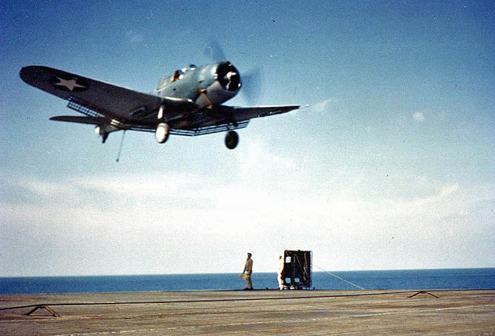 The Landing Signal Officer (LSO) on the aircraft carrier USS Ranger (CV-4) waves off a Douglas SBD Dauntless aircraft, June 1942.