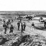 Pilots and P-40 Warhawk aircraft of the 11th Fighter Squadron at Fort Glenn Army Air Base, Alaska, June 1942. (U.S. Air Force Photograph.)