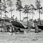 A P-40 Warhawk of the Flying Tigers undergoes maintenance at Kunming, China during World War II. (U.S. Air Force Photograph.)