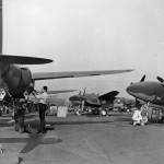 Lockheed P-38 Lightning aircraft receive maintenance and final inspections on the assembly line outside the aircraft plant, circa 1942. (U.S. National Archives)