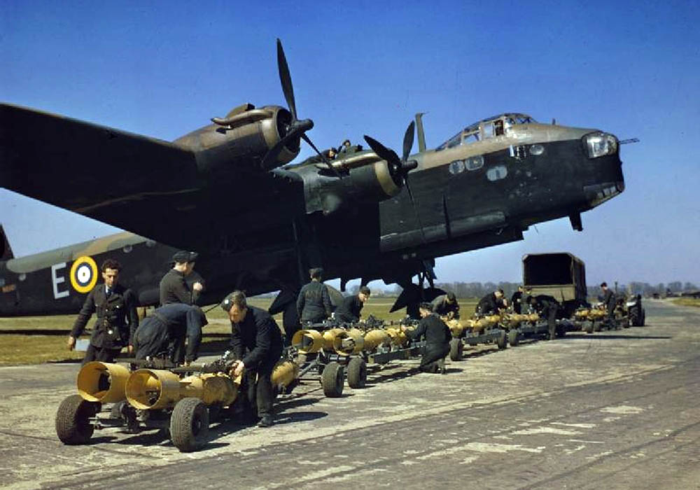 Royal Air Force crew prepare to load 250 lb bombs into a Short Stirling bomber of No. 1651 Heavy Conversion Unit at Waterbeach, Cambridgeshire.