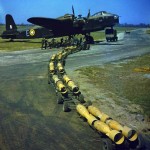 Sixteen 250 lb. bombs wait to be loaded on a Short Stirling bomber of No. 1651 Heavy Conversion Unit at Waterbeach, Cambridgeshire. (Imperial War Museum Photograph.)