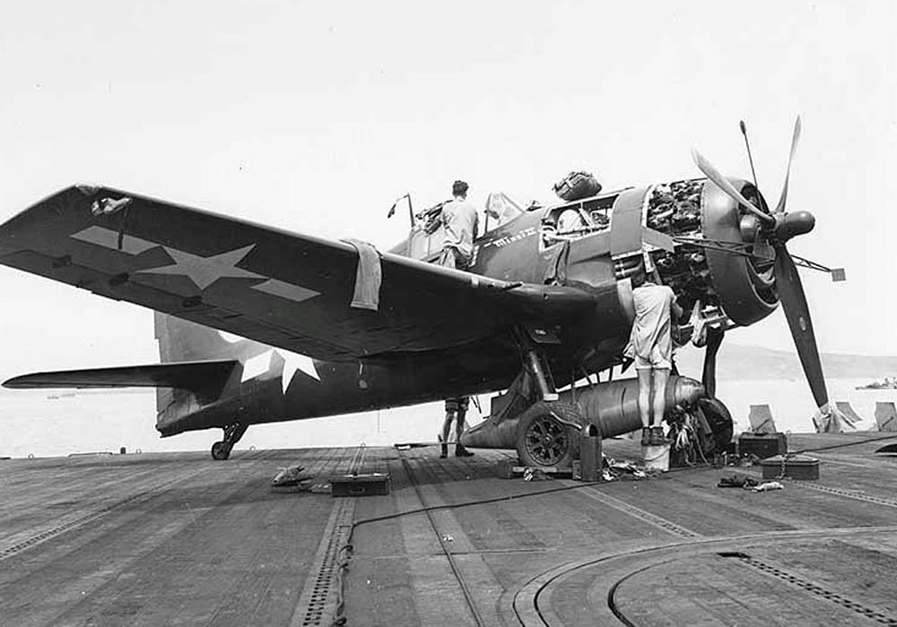 Maintenance work on the F6F Hellcat "Minsi II" on board the USS Essex off the coast of Saipan, July 1944. (Official U.S. Navy Photograph.)