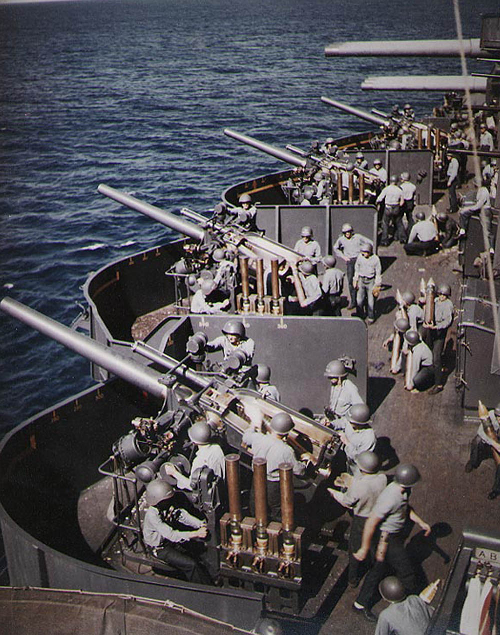 Battleship USS New Mexico (BB-40) in action during the bombardment of Saipan, June 1944. (Official U.S. Navy Photograph.)