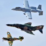 A-10 Thunderbolt II (top), F-4 Phantom (middle), and P-40 Warhawk fly in formation during the Heritage Flight Conference.