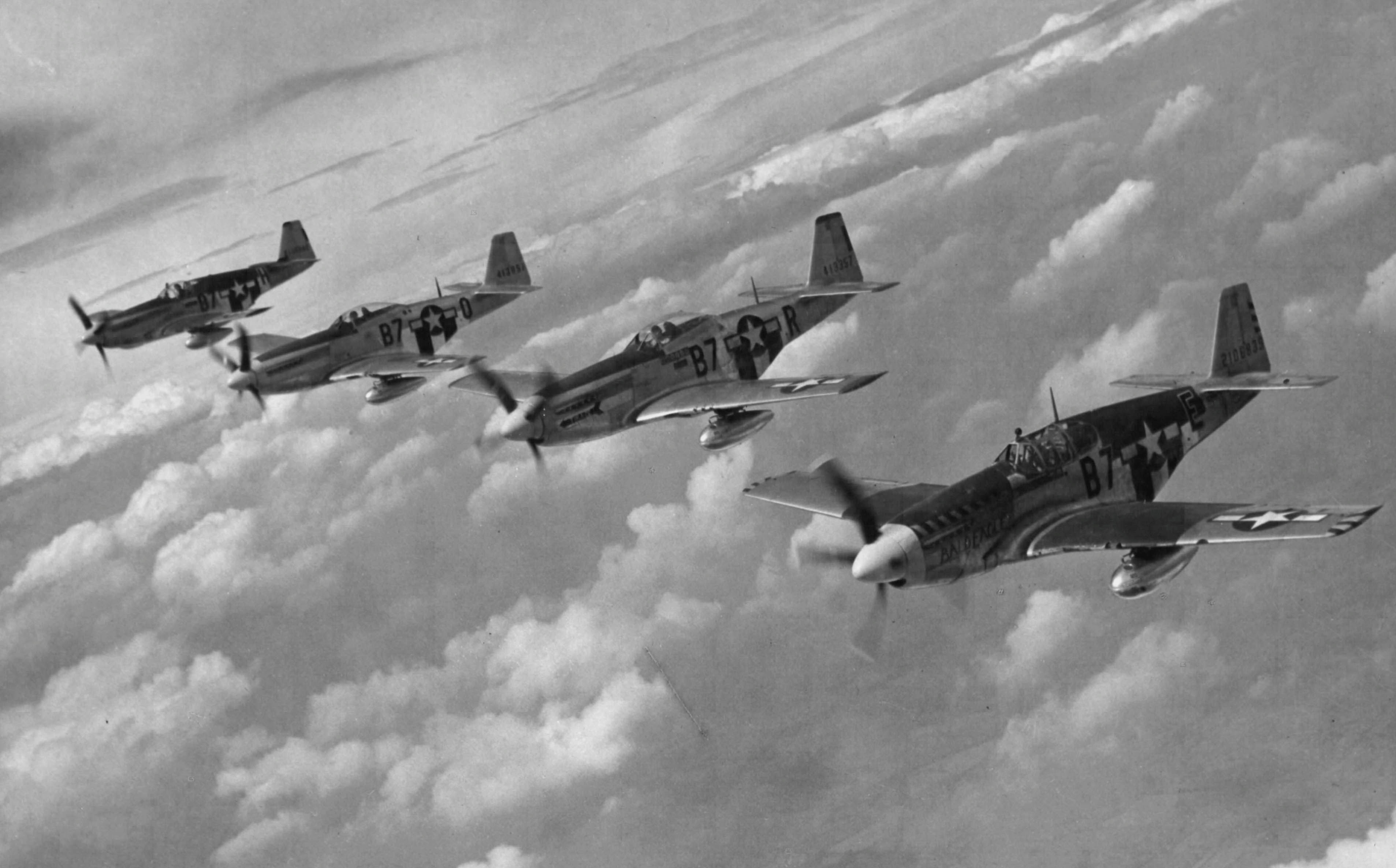 A formation of P-51 Mustangs from the 374th FS, 361st FG of the Eighth Air Force photographed over England during World War II. (U.S. Air Force Photograph.)