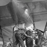 A Boeing B-29 Superfortress has a wheel changed by ground crew at North Field on Guam, May 1945. (U.S. Air Force Photograph.)