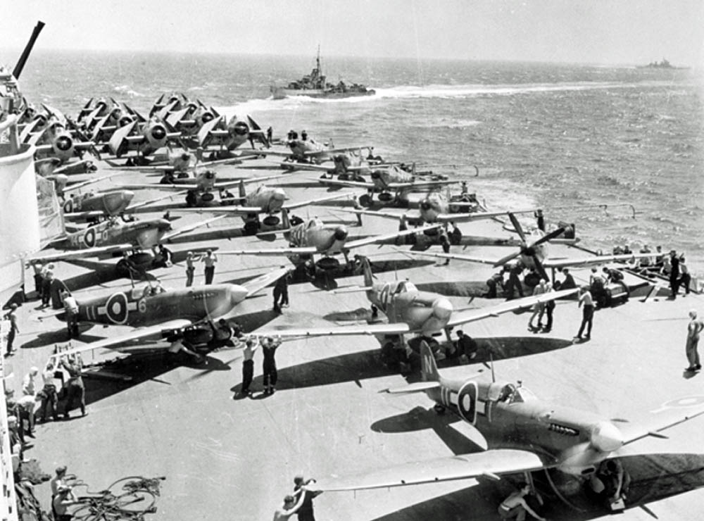 Royal Navy aircraft carrier HMS Implacable with Avengers and Seafires on the flight deck, 1945. (Australian War Memorial Photograph.)