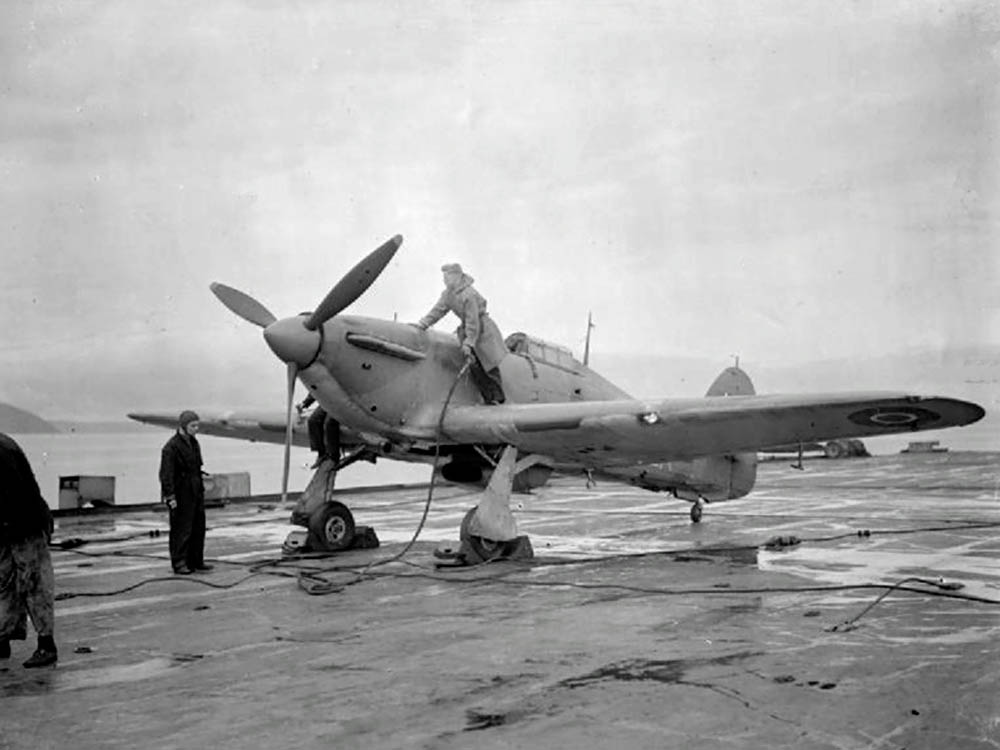 A Hawker Sea Hurricane of the Royal Navy is refueled on the flight deck of the HMS Argus (Imperial War Museum Photograph.)