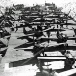 Grumman F4F-4 Wildcats and Royal Air Force Supermarine Spitfires on the deck of the aircraft carrier USS Wasp (CV-7), April 1942. (U.S. Navy Photograph.)