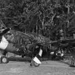 A camouflage Republic P-47 Thunderbolt fighter parked on an airfield near St. Lo, France during the summer of 1944. (U.S. Air Force Photograph.)