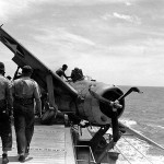 A Brewster F2A-3 Buffalo fighter suffers a landing gear failure on board the USS Long Island in July 1942. (U.S. Navy Photograph.)