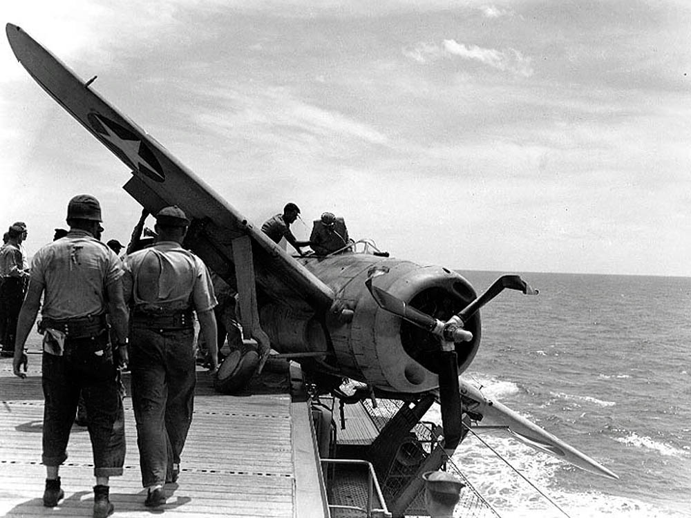 A Brewster F2A-3 Buffalo fighter suffers a landing gear failure on board the USS Long Island in July 1942. (U.S. Navy Photograph.)