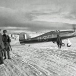 An RAF Hawker Hurricane Mk IIB fighter photographed with Russian sentries near Murmansk, October 1941. (Imperial War Museum Photograph.)