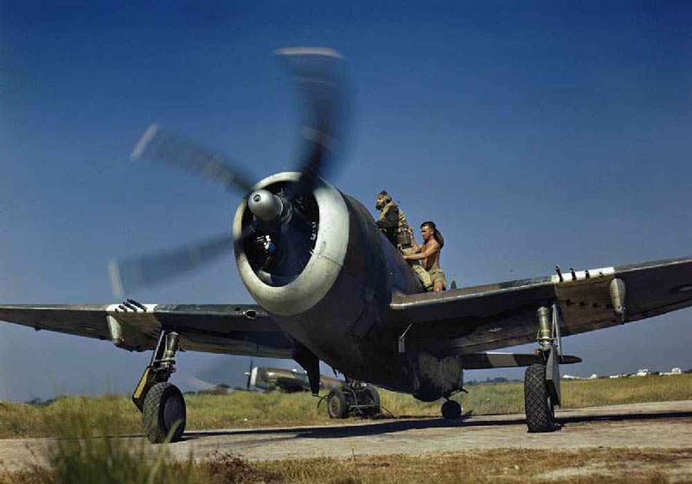 A pilot boards a Royal Air Force Republic P-47 Thunderbolt Mk II of No 30 Squadron. (Imperial War Museum Photograph.)