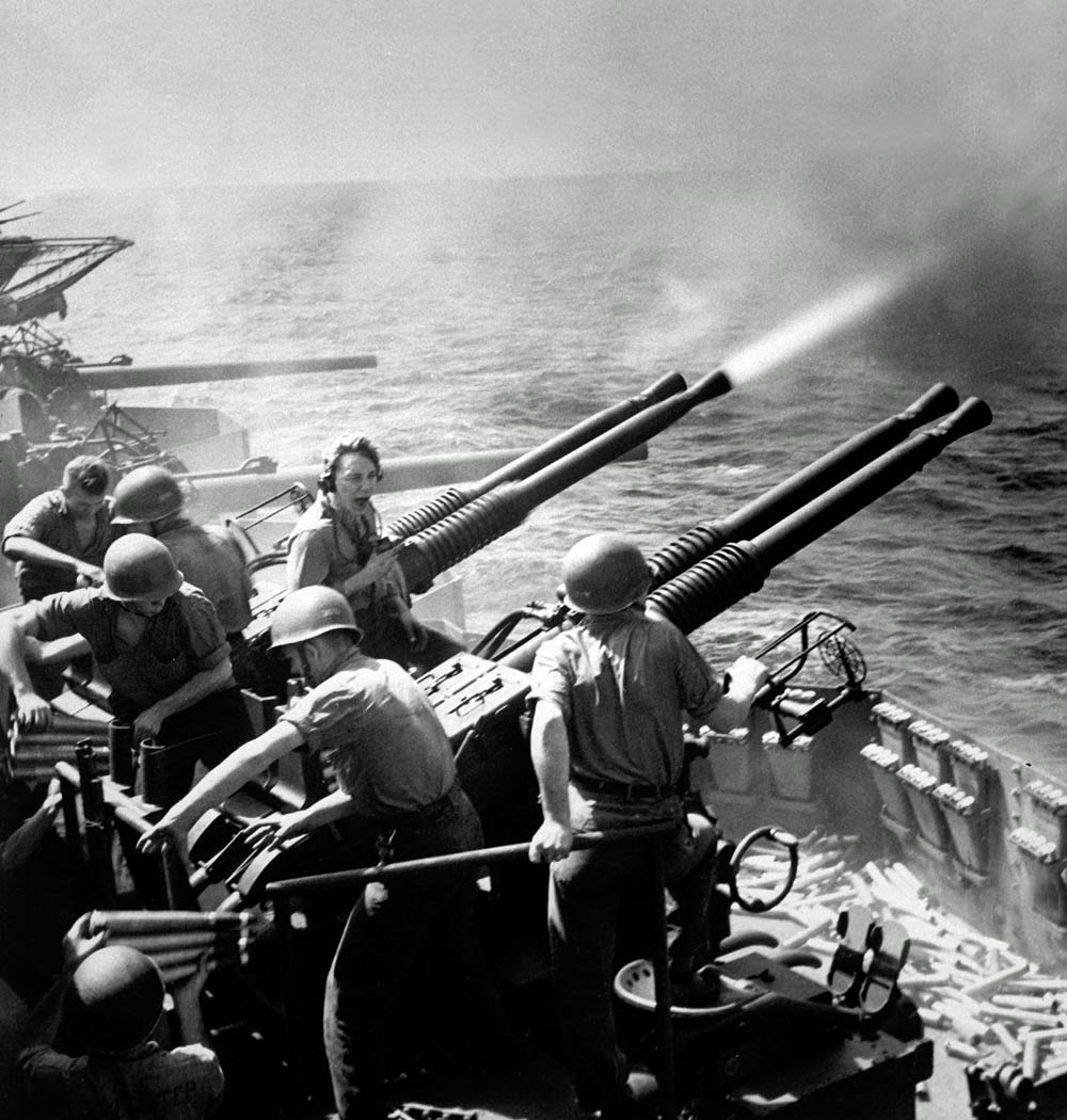 Quad 40mm antiaircraft guns firing aboard the U.S. Navy aircraft carrier USS Hornet (CV-12) in February 1945. (U.S. Navy Photograph.)